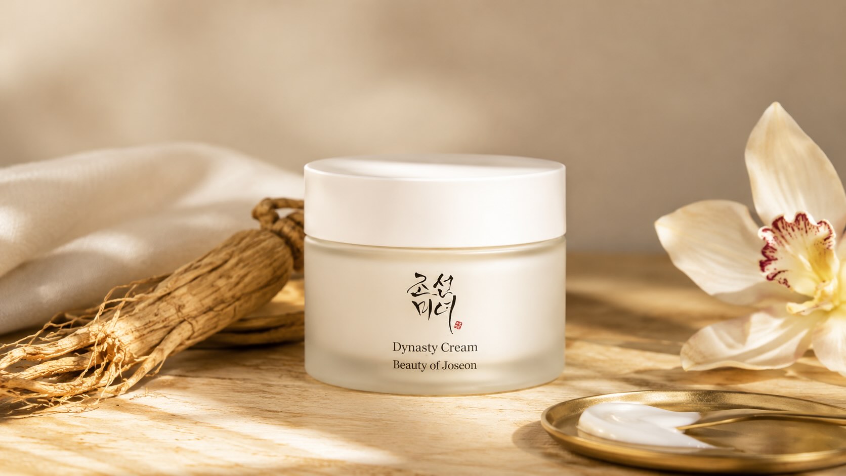 Beauty of Joseon Dynasty Cream jar with ginseng root and orchid on warm beige background