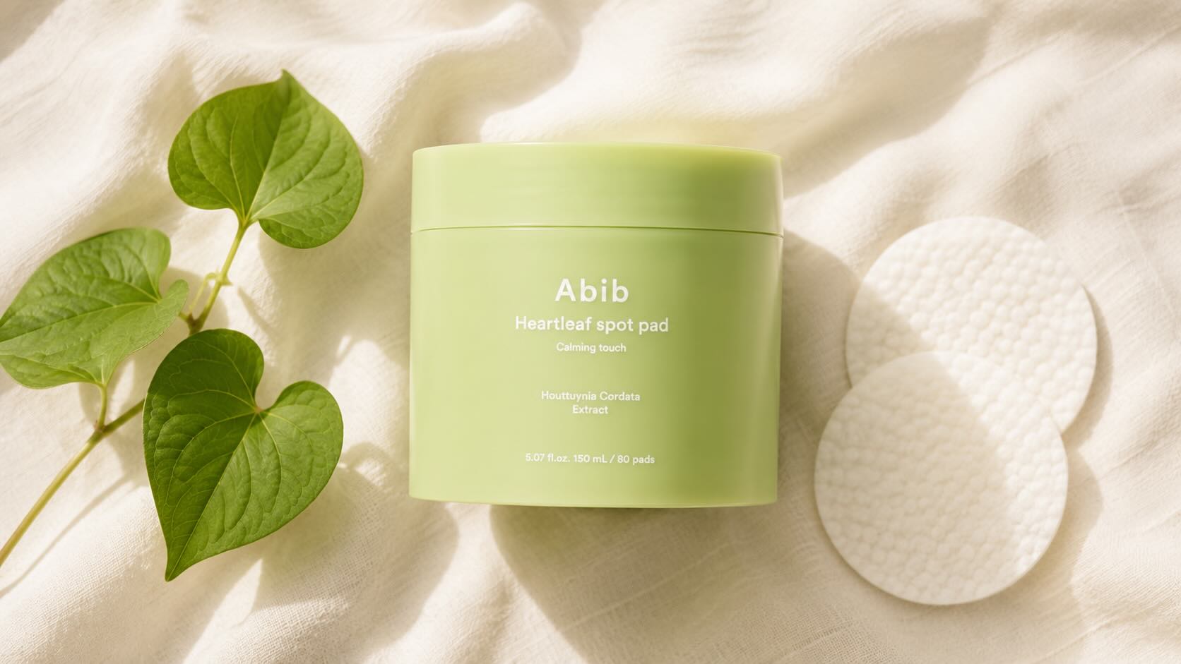 Abib Heartleaf Spot Pad Calming Touch jar with embossed toner pads visible inside on neutral cream background