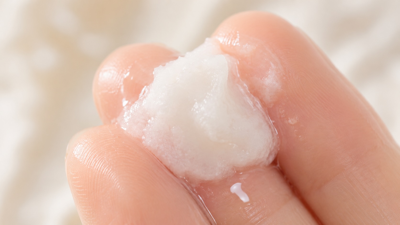 Banila Co Clean It Zero Cleansing Balm sherbet texture melting on fingertips into oil consistency