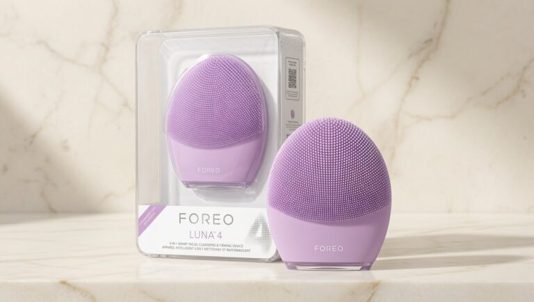 FOREO LUNA 4 Face Massager lilac silicone device on cream marble background