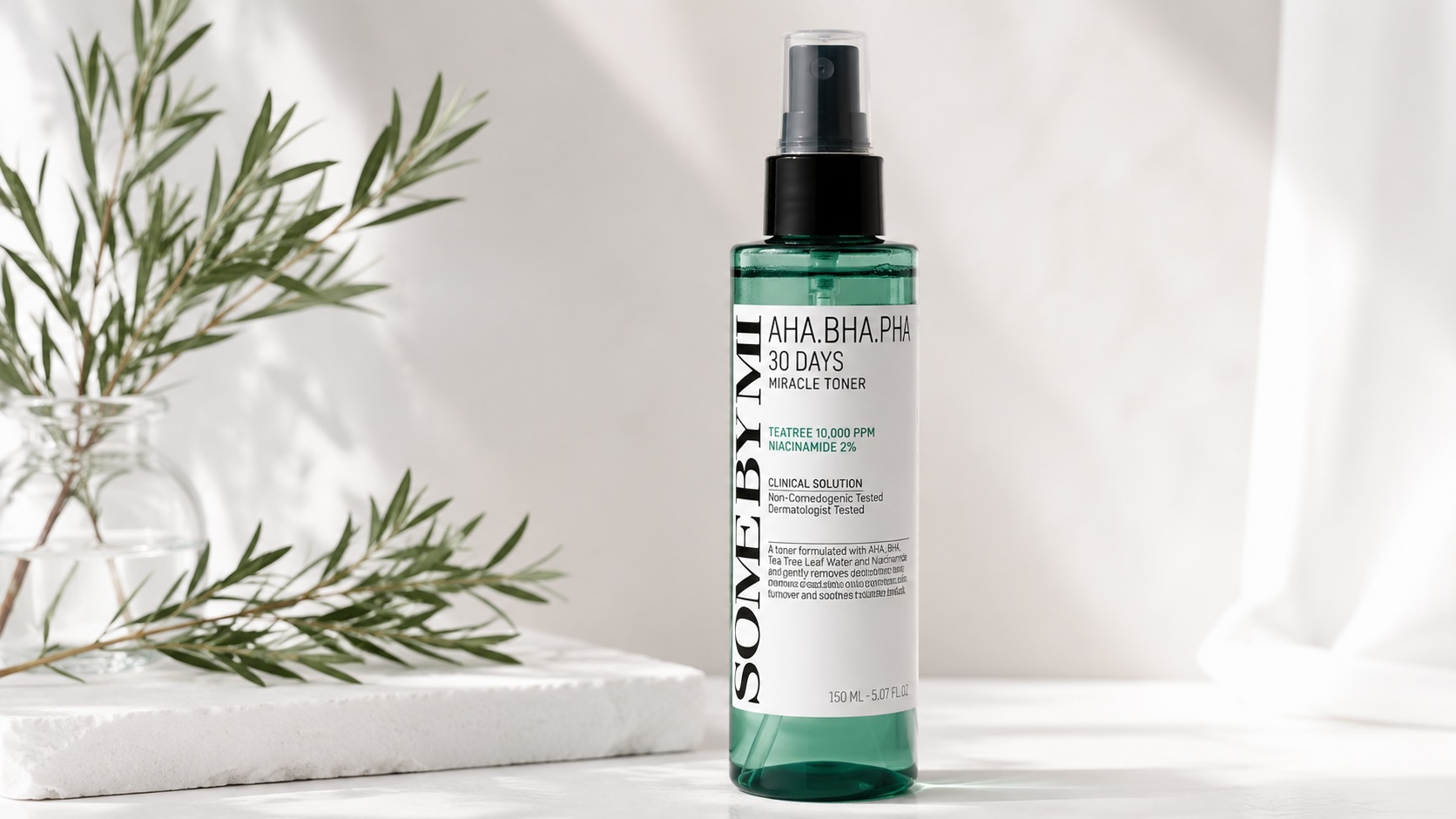 Some By Mi AHA-BHA-PHA 30 Days Miracle Toner bottle on minimalist white surface with tea tree leaves