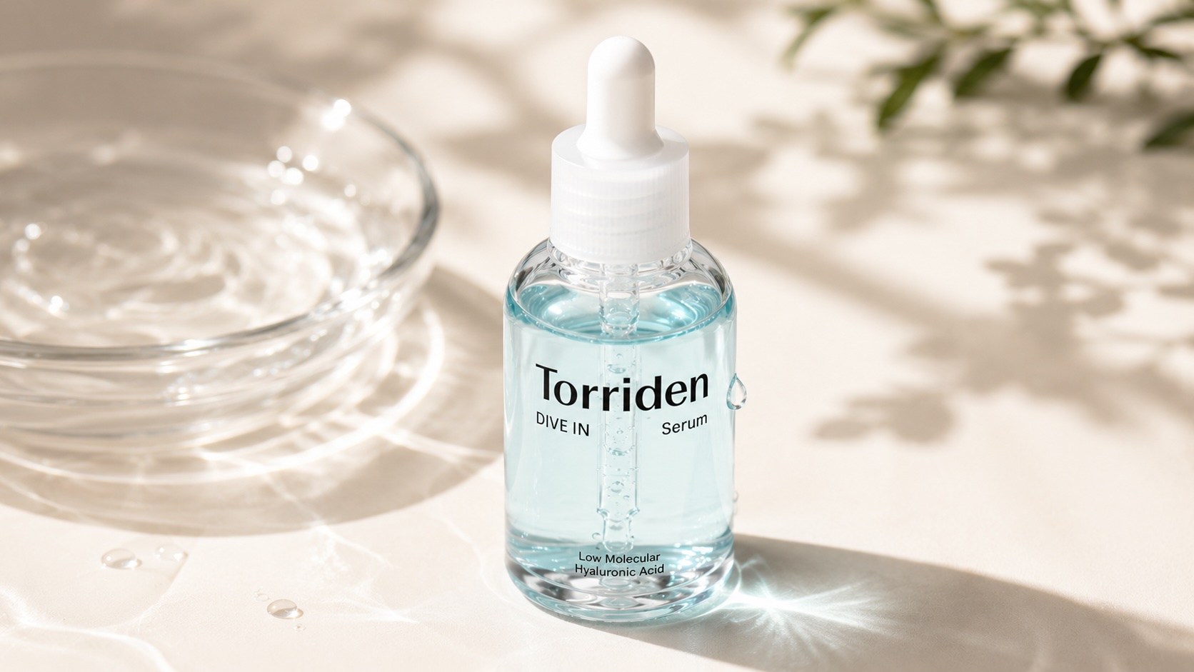 Torriden DIVE-IN Low Molecular Hyaluronic Acid Serum clear bottle on minimalist surface