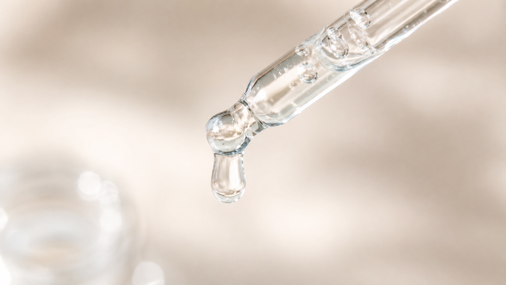 Torriden DIVE-IN Serum watery texture being dispensed from dropper showing clear hyaluronic acid liquid